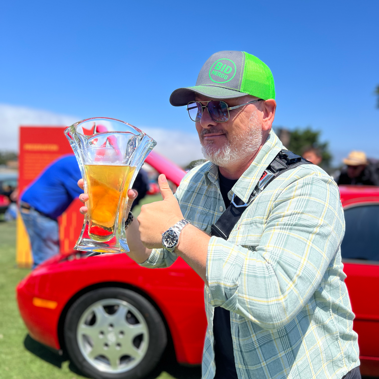2025 Porsche Classic Challenge Award in the hand of JP from the BID Nerds Podcast